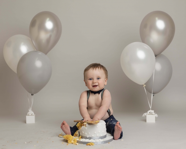 Grey and white cake smash theme by Wirral photographer