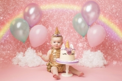 Unicorn and Rainbow first birthday cake smash by Wirral Photographer