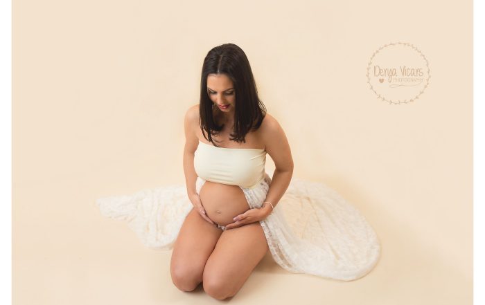 Beautiful Maternity Photo with flowing white lace dress baby bump and makeup