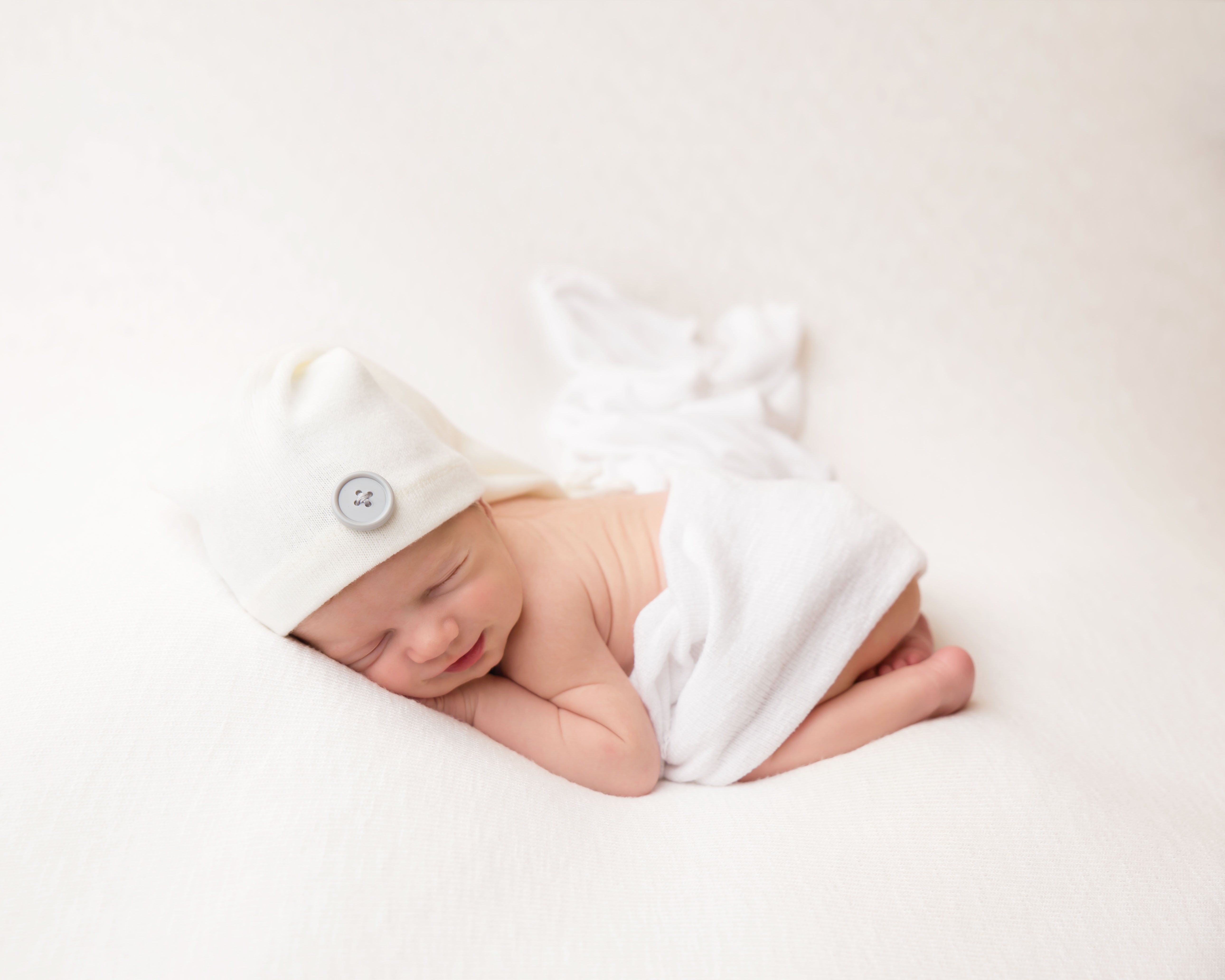 Wirral photo studio for babies, baby in tucked position