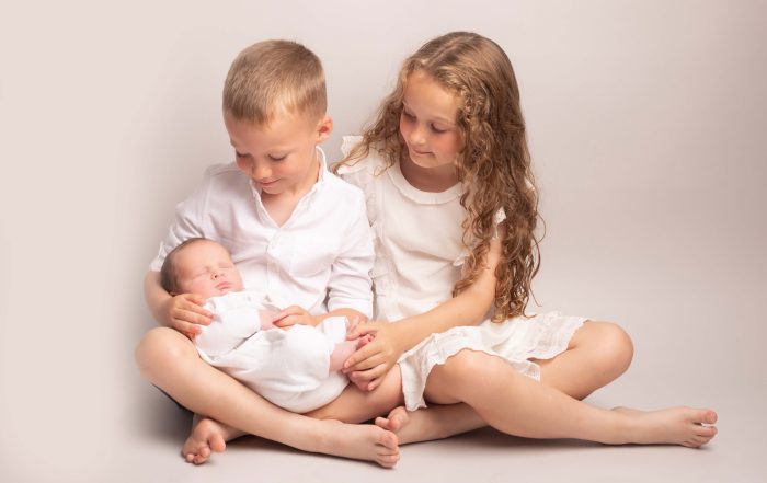 Siblings with newborn baby Cheshire